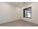 Bright and airy room with tile flooring and a large window providing natural light and a view of the outdoors at 28421 N 59Th Way, Cave Creek, AZ 85331