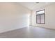 Minimalist bedroom with tile flooring, a modern window, and neutral tones creating a serene and bright ambiance at 28421 N 59Th Way, Cave Creek, AZ 85331
