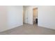 Bright bedroom featuring light tile flooring and an adjacent bathroom, showcasing modern design elements at 28421 N 59Th Way, Cave Creek, AZ 85331