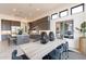 Contemporary dining area with sleek gray cabinets, modern lighting, and dining table for a stylish home at 28421 N 59Th Way, Cave Creek, AZ 85331
