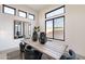 Bright dining area featuring a rustic wood table, modern seating, and stylish decor under natural light at 28421 N 59Th Way, Cave Creek, AZ 85331