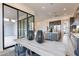 Bright dining area with a modern table, chairs, and views of the open-concept kitchen at 28421 N 59Th Way, Cave Creek, AZ 85331