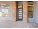 Welcoming entryway featuring stone pillars, modern windows, and stylish front door at 28421 N 59Th Way, Cave Creek, AZ 85331