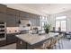 Modern kitchen boasting a large island, sleek cabinetry, and stainless steel appliances at 28421 N 59Th Way, Cave Creek, AZ 85331