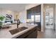 Modern kitchen featuring a central island with stainless steel sink, and stainless steel refrigerator at 28421 N 59Th Way, Cave Creek, AZ 85331