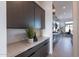 Modern kitchen with dark cabinetry, sleek countertops, and high-end appliances at 28421 N 59Th Way, Cave Creek, AZ 85331