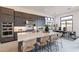 Spacious kitchen featuring a large island, stainless steel appliances, and dining area with modern decor at 28421 N 59Th Way, Cave Creek, AZ 85331