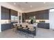 Contemporary kitchen with a large center island, modern appliances, and stylish bar stool seating at 28421 N 59Th Way, Cave Creek, AZ 85331