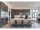 Modern kitchen featuring a large island with bar seating and stainless steel appliances at 28421 N 59Th Way, Cave Creek, AZ 85331