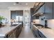 Modern kitchen with an island, stainless steel appliances, and sleek gray cabinets at 28421 N 59Th Way, Cave Creek, AZ 85331