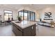 Open concept kitchen with a large center island, modern appliances, and bright, natural light at 28421 N 59Th Way, Cave Creek, AZ 85331