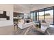 Open-concept living room featuring a stylish white sofa, modern rug, and sleek design elements at 28421 N 59Th Way, Cave Creek, AZ 85331