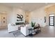 Bright living room showcasing a fireplace, modern decor, and an open concept design with ample space at 28421 N 59Th Way, Cave Creek, AZ 85331