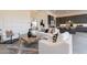 Inviting living room with contemporary furnishings, neutral tones, and seamless flow into adjacent spaces at 28421 N 59Th Way, Cave Creek, AZ 85331