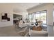 Spacious living room flowing into the kitchen, featuring modern decor and an open-concept design at 28421 N 59Th Way, Cave Creek, AZ 85331