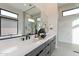 Modern main bathroom boasts double sinks, a large mirror, and a luxurious shower with beautiful marble tiling at 28421 N 59Th Way, Cave Creek, AZ 85331