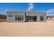 Contemporary home displaying clean lines, large windows, and a low-maintenance gravel yard at 28421 N 59Th Way, Cave Creek, AZ 85331