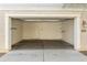 This spacious garage offers ample parking and storage, with shelving and a door to the home at 2947 N Evergreen St, Buckeye, AZ 85396