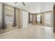 Bright and airy living room with tile flooring, lots of natural light, and a view into other rooms at 2947 N Evergreen St, Buckeye, AZ 85396