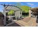 Secluded backyard oasis with a charming pergola, fire pit, and outdoor seating, perfect for relaxation at 3202 W Knudsen Dr, Phoenix, AZ 85027