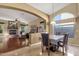 Open-concept dining room featuring neutral paint, tile floor, and a view of the living room makes it perfect for entertaining at 3202 W Knudsen Dr, Phoenix, AZ 85027