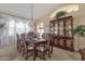 Elegant dining room featuring a chandelier, formal furniture, and natural light at 3202 W Knudsen Dr, Phoenix, AZ 85027