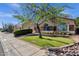 Charming single-story home with a landscaped front yard and stone accents at 3202 W Knudsen Dr, Phoenix, AZ 85027