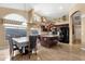 Well-lit kitchen with dark cabinets, an island with seating, and updated appliances is ideal for everyday living at 3202 W Knudsen Dr, Phoenix, AZ 85027
