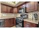 Functional kitchen with stainless steel appliances and lots of cabinet space at 3202 W Knudsen Dr, Phoenix, AZ 85027