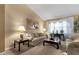 Cozy living room with comfortable seating, decorative lamps, and natural light at 3202 W Knudsen Dr, Phoenix, AZ 85027