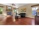 Welcoming living room with a cozy fireplace, hardwood flooring, and a comfortable leather sofa at 3202 W Knudsen Dr, Phoenix, AZ 85027