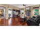 Spacious living room boasting a fireplace, entertainment center, and seamless access to the outdoors at 3202 W Knudsen Dr, Phoenix, AZ 85027