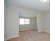 Bedroom with a large window and neutral carpet at 3249 E Sunnyside Ln, Phoenix, AZ 85032
