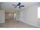 Bright living room features modern ceiling fan, and light wood-look floors, perfect for relaxation and entertaining at 3249 E Sunnyside Ln, Phoenix, AZ 85032