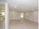 Bright, open living room with wood-look floors provides ample space and a seamless transition to the adjacent kitchen at 3249 E Sunnyside Ln, Phoenix, AZ 85032