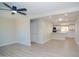 Spacious living area showcases modern flooring, neutral tones, and ample lighting with an open view to kitchen at 3249 E Sunnyside Ln, Phoenix, AZ 85032