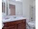 Bathroom with tiled shower over bathtub, marble countertop, and a sink at 3574 E Glacier Pl, Chandler, AZ 85249