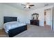 This bedroom has carpet floors, a fan, and a dresser with a mirror at 3574 E Glacier Pl, Chandler, AZ 85249