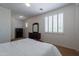 Bedroom with plantation shutters, ceiling fan and carpeting at 3574 E Glacier Pl, Chandler, AZ 85249