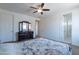 Spacious bedroom with a ceiling fan and view to the closet and bathroom at 3574 E Glacier Pl, Chandler, AZ 85249
