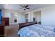Comfortable bedroom with a ceiling fan, a cozy bed, and plenty of natural light at 3574 E Glacier Pl, Chandler, AZ 85249