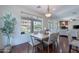 Bright dining room with hardwood floors and a window view of the pool at 3574 E Glacier Pl, Chandler, AZ 85249