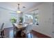 Bright dining room with hardwood floors with natural light streaming in through large windows at 3574 E Glacier Pl, Chandler, AZ 85249