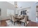 Bright dining area with hardwood floors and plantation shutters at 3574 E Glacier Pl, Chandler, AZ 85249