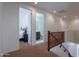 Upstairs hallway featuring views of a bedroom and bathroom at 3574 E Glacier Pl, Chandler, AZ 85249