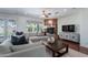 Comfortable living room featuring a fireplace and French doors to the backyard at 3574 E Glacier Pl, Chandler, AZ 85249