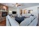 Cozy living room with a stone fireplace and comfortable seating at 3574 E Glacier Pl, Chandler, AZ 85249
