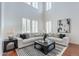 Spacious living room with high ceilings, plantation shutters, and a modern design at 3574 E Glacier Pl, Chandler, AZ 85249