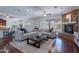 Open living area with a fireplace, wood floors, and ample natural light at 3574 E Glacier Pl, Chandler, AZ 85249
