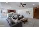 Spacious living room with a bar and staircase, perfect for entertaining and Gathering living at 3574 E Glacier Pl, Chandler, AZ 85249